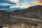 Thingvellir, steep valley formed by the separation of two tectonic plates, with rocky cliffs and fissures. Selfoss