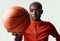 Think girls cant play ball Think again. Studio shot of an attractive young woman playing basketball against a grey