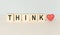 THINK message word on a wooden desk