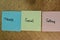 Think, Social, Selling write on sticky notes isolated on Wooden Table