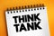 Think tank - research institute that performs research and advocacy concerning topics, text concept on notepad