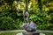 Thinker on a rock - Bronze sculpture of long earred rabbit figure sitting on a rock by Barry Flanagan