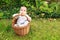 Thinking baby boy in wicked basket