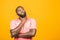 Thinking black Afro American man with serious expression looking, posing isolated against yellow background