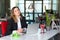 Thinking Business Lady in official clothing sitting at Office Table