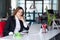 Thinking Business Lady in official clothing sitting at Office Table