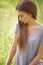 Thinking, grass and woman relax in field for reflection, memories and thought on summer weekend. Nature, countryside and