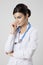 Thinking medical doctor woman with stethoscope.