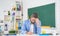 thinking school tutor in classroom at blackboard