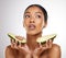 Thinking, skincare and woman with avocado in studio for healthy skin, wellness and nutrition. Female model, face and