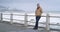 Thinking, thoughtful and concerned senior man standing near the beach on a cold day. Stressed, worried and lonely mature