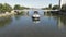 Thionville, France - 08 22 2023: long cargo ship on the Moselle passing bridges