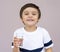 Thirsty cute boy drinking cold and clean water, Portrait of Caucasian toddler boy drinking glass of water,Healthy kid holding