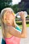 Thirsty fit woman gulping down water from bottle