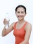 Thirsty fitness girl drinking bottle of water