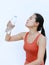 Thirsty fitness girl drinking bottle of water