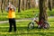 Thirsty little boy cyclist drinking bottled water