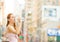 Thirsty woman. Woman drinking water from plastic bottle in a city on summer day