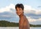 Thirteen year old Amerasian boy smiling beside Grand Lake in the State of Oklahoma