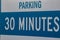 Thirty minute parking sign stating limits for parking on private property