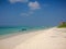 Thoddoo Alif Alif Atoll, Maldives - February 12, 2017: Beautiful sandy beach, motor boats and azure water on the island of