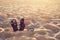 Thongs and sunglasses on beach sand