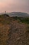 Thorny path to god. Stony path leading to the cross. Summer sunrise