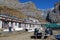 The Thorong Phedi lodge, with backpacks outside the lodges below Thorong La Pass on the Annapurna Circuit. With the buildings surr