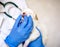 Thorough checkup. Closeup of a professional vet examining teeth of a puppy.Cute white puppy, dog teeth examination, vet doctor and