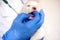 Thorough checkup. Closeup of a professional vet examining teeth of a puppy.Cute white puppy, dog teeth examination, vet doctor and
