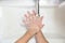 Thorough washing of men hands  soap foam and water