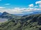 Thorsmork valley with green vegetation of moss, fern, birchwood under blue sky in sunny summer day, Iceland