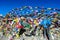 Thorung La Pass - A man standing between the prayer flags on top of the pass