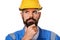 Thoughtful bearded builder in hard hat, foreman or repairman in the helmet. Close up portrait architect builder, civil engineer