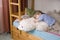 Thoughtful Boy With Soft Toy Lying On Bunk Bed
