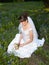 Thoughtful bride in bluebonnet field