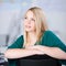 Thoughtful Businesswoman Looking Up While Sitting On Chair