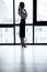 Thoughtful businesswoman standing near window