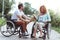 Thoughtful disabled man surprising his soulmate with flowers