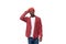 thoughtful doubting young american man in red cap and plaid shirt scratching his head on white background with copy