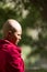 Thoughtful earnest young buddhist nun from Jelichun nunnery, pro