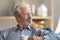 Thoughtful elderly man loo in distance thinking or mourning