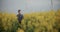 Thoughtful Farmer Amidst Flowering Plants In Farm.