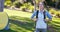 Thoughtful female hiker standing with hands in pockets