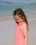 Thoughtful girl on beach