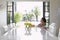 Thoughtful Girl Sitting At Dining Table