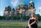 Thoughtful girl tourist sitting in germany near berlin cathedral. berlin cathedral view in germany with sitting girl