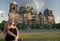 Thoughtful girl tourist sitting in germany near berlin cathedral. berlin cathedral view in germany with sitting girl