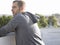 Thoughtful Man Leaning On Wall Looking Away