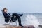 Thoughtful Man Sitting on his Chair at the Seaside